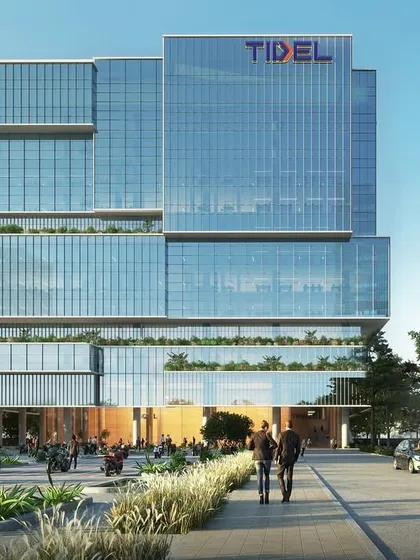 This rendering of TIDEL Park in Madurai illustrates our vision for future-ready IT campuses. The design features a stepped, fragmented built form that creates self-shaded terraces and green breakout spaces on every level, promoting a healthy work-life balance.