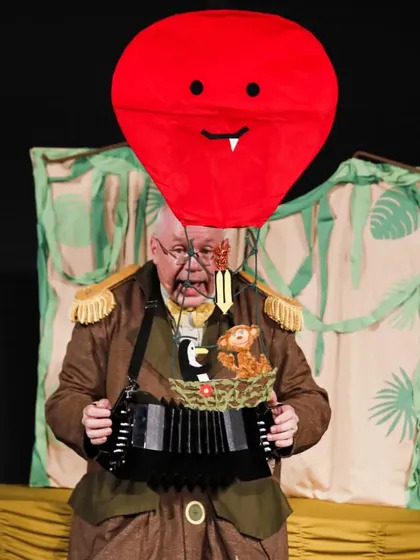 A humorous moment where a red balloon character appears in 'Penguin in my Pocket', showcasing the show's quirky and imaginative style.