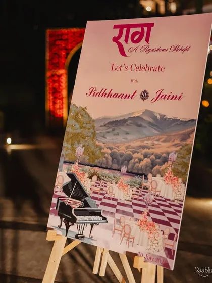 A beautifully illustrated welcome sign, featuring a custom painting of the venue and event theme.