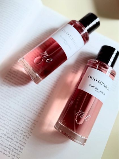 Another angle of the engraved Dior bottles, highlighting how the light catches the delicate lines of the engraving.
