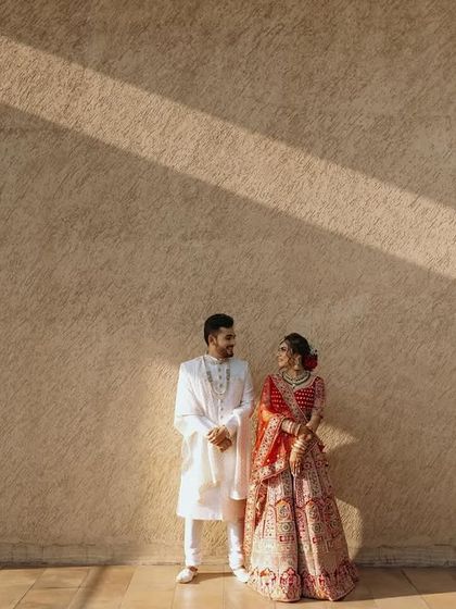 A wide shot using the lines of shadows to create a dramatic and artistic composition for this couple's portrait.