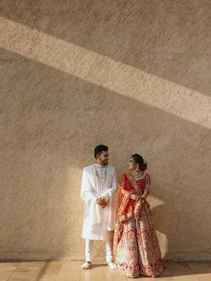 A wide shot using the lines of shadows to create a dramatic and artistic composition for this couple's portrait.