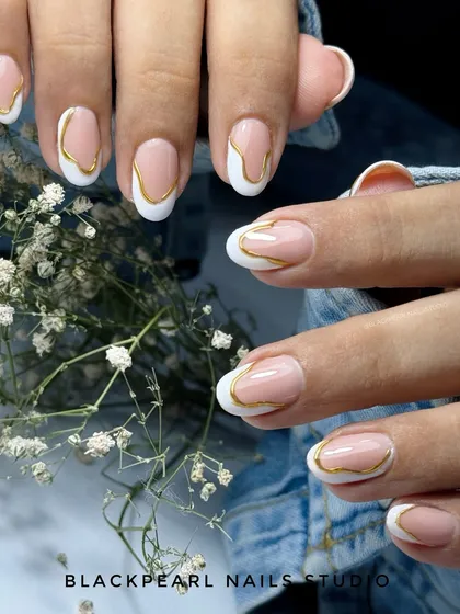 A modern take on a classic, these abstract French nails feature a clean white tip with a sleek, hand-painted gold chrome border. This design highlights my precision work and ability to transform a traditional style into something contemporary and chic.