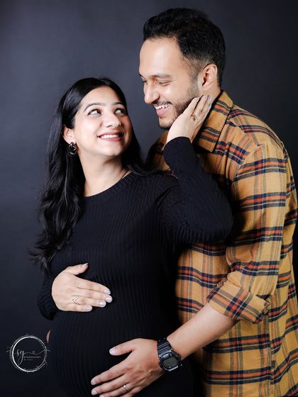A playful and loving interaction between the couple. These candid moments of laughter and joy are what make a session so special.