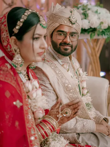 An intimate moment on stage, with the groom looking lovingly at his bride. These are the quiet moments that I seek to capture.