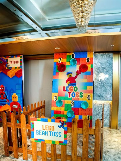 A LEGO-themed "Bean Toss" carnival game for guests to test their aim.