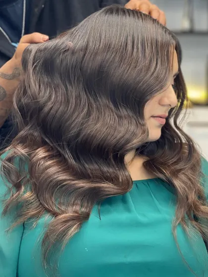 A side view of this stunning brown hair, showing off the healthy waves and beautiful color.