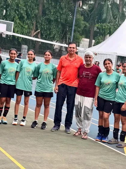 Our girls' team getting some final words of wisdom from Mr. Anjan Ghosh, a Shanghai expert, before their tour. Cultural prep is just as important as on-court practice.