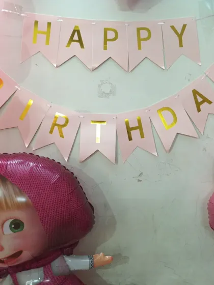 Themed 'Happy Birthday' banner and character balloons for the Masha party.