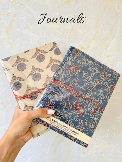 A pair of our beautiful handmade journals, showcasing the intricate block-printed designs that make each one unique.