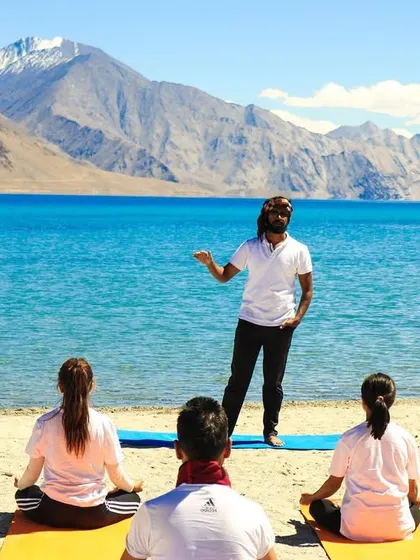 Teaching a corporate wellness workshop against the serene backdrop of the Himalayas. I believe that changing the environment can profoundly impact learning, helping teams to absorb stress management techniques more deeply.
