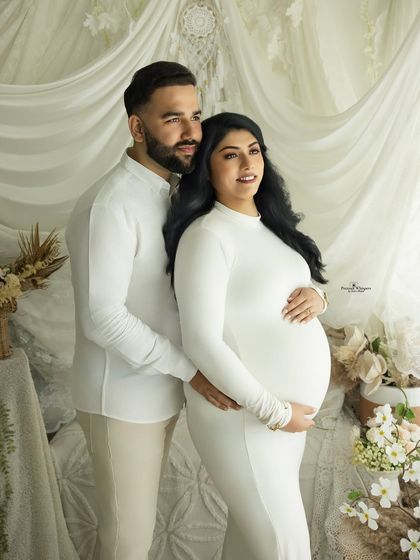 A classic couple's portrait in our white boho setup. Their coordinated white outfits create a clean, fresh, and timeless look.