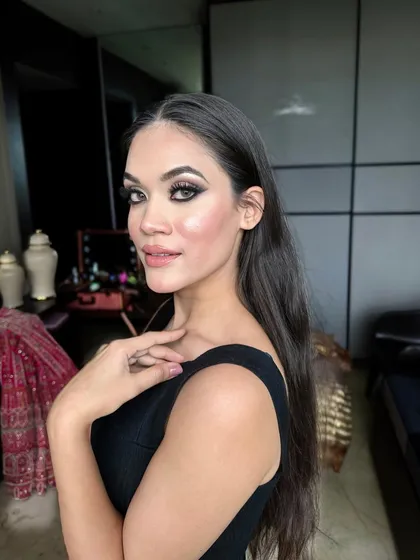 Another candid from the shoot, this time with a bit more attitude. The bold smokey eye and contoured features create a powerful and edgy look.