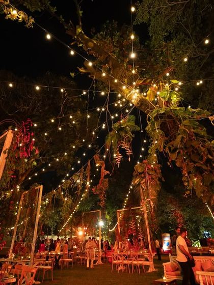 An enchanting Lohri celebration under a canopy of fairy lights. I used vegetables as unique decor elements for tabletops and hangings, all bathed in a warm red glow to create an unforgettable and rustic-chic ambiance.