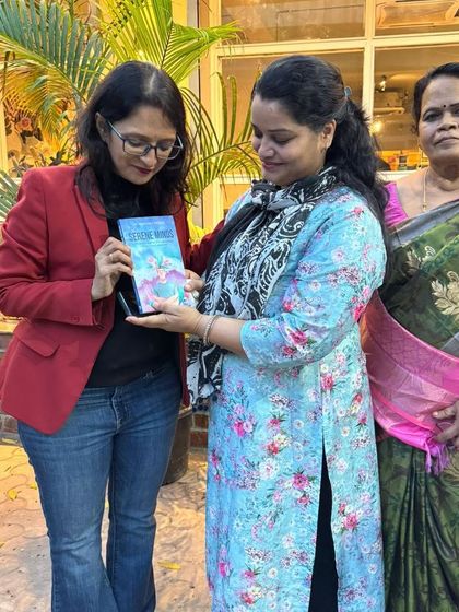 Holding my book 'Sacred Words' with a reader. Reading was never just a habit for me; it was a necessity that led me to writing.