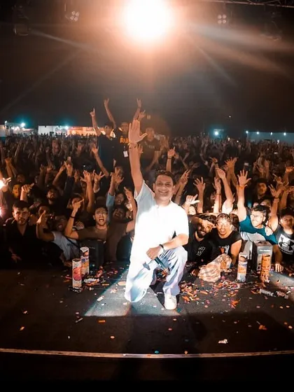 On stage at IIT Patna, connecting with a massive crowd of students. The energy at college festivals is unmatched, and I make sure it's a night they remember with full-scale production, including pyrotechnics.