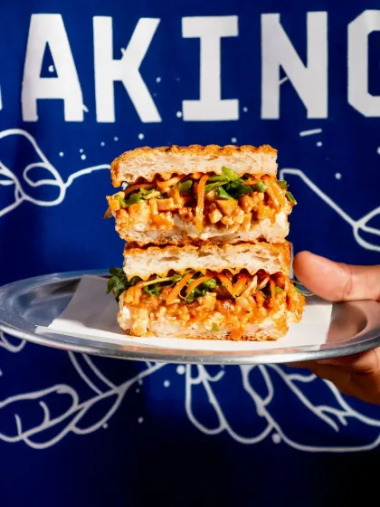 The Pulled Pork Kimchi Focaccia held against our signature 'No-Bullsh*t Baking' branding.