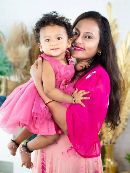 A mother's warm embrace. This portrait beautifully showcases the love and affection between a mom and her little one.