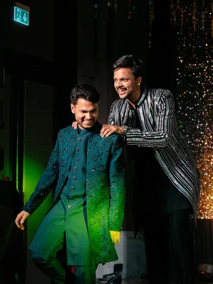 A moment of camaraderie between the groom and one of our choreographers. We're there to support you every step of the way, from rehearsals to the final performance.