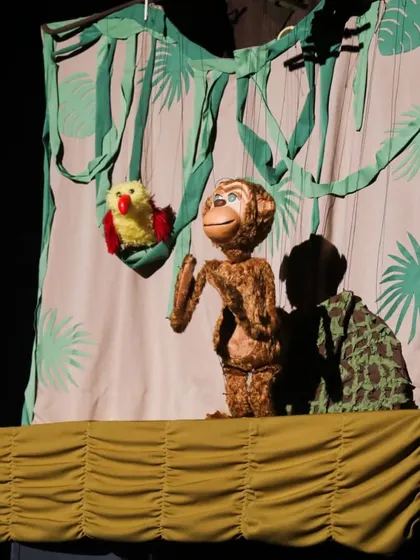 The jungle-themed stage for 'Penguin in my Pocket'. The simple yet effective backdrop sets the scene for a whimsical adventure.