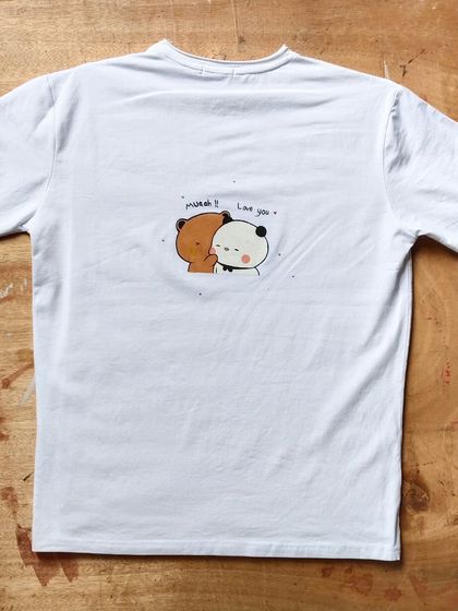 A fun surprise on the back. For this custom portrait tee, the client requested a cute Bubu and Dudu doodle on the back, adding another layer of personalization.