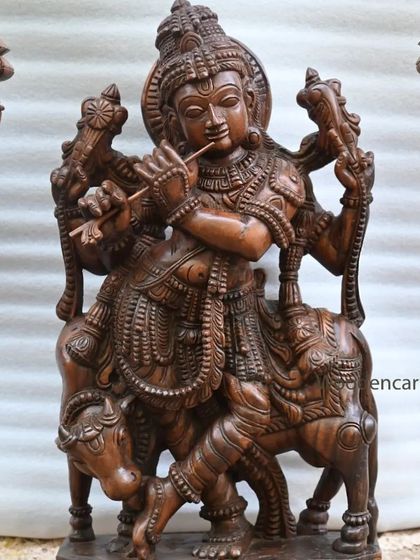 A closer view of the 36-inch standing Krishna, detailing the intricate carvings on his attire and the cow by his side.