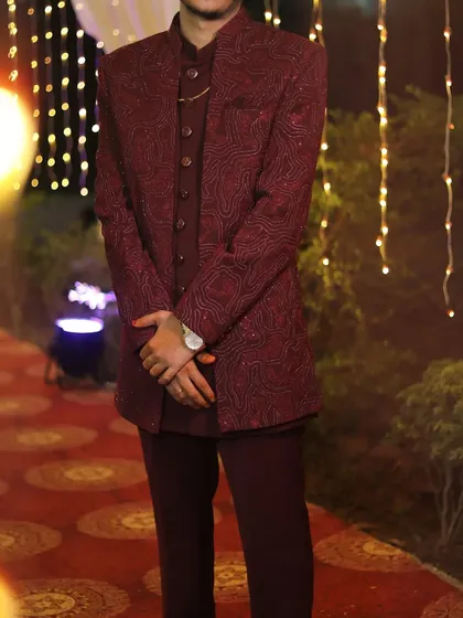 We also offer menswear for rent, like this stylish maroon three-piece Jodhpuri suit. It's a great option for attending a wedding or reception.