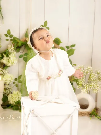 A playful, pouty face. It's the full range of expressions that truly captures a child's personality at this age.