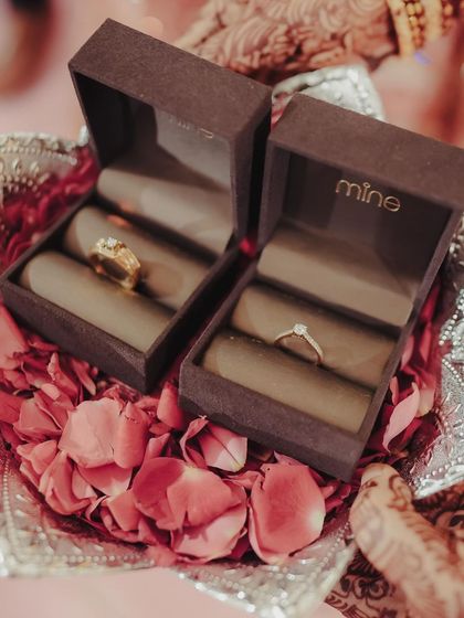 The wedding rings, beautifully presented on a silver platter filled with fresh rose petals. We believe in making every detail, no matter how small, picture-perfect.