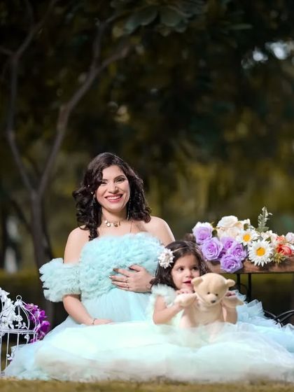 Happiness is on the way, and it's a moment to share. An outdoor maternity shoot with an older sibling makes for a beautiful family memory.
