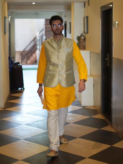 Striding through the corridor of the resort, ready to get to the venue and kick off the celebrations.