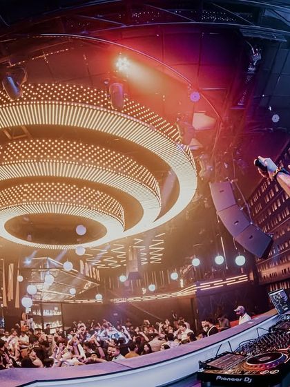 A fisheye view of the DJ booth and the stunning circular light fixture at Prism.