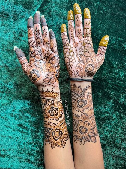 A close-up of the fusion floral design, showing the different techniques used on each hand.