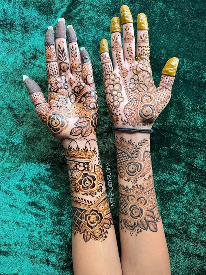 A close-up of the fusion floral design, showing the different techniques used on each hand.