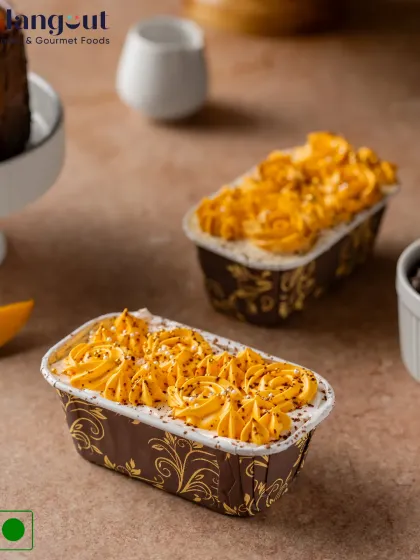 Where tropical elegance meets classic Italian charm. Our Mango Tiramisu Glazed Bar Cake is a stunning dessert with layers of mango-infused cream and soft sponge.