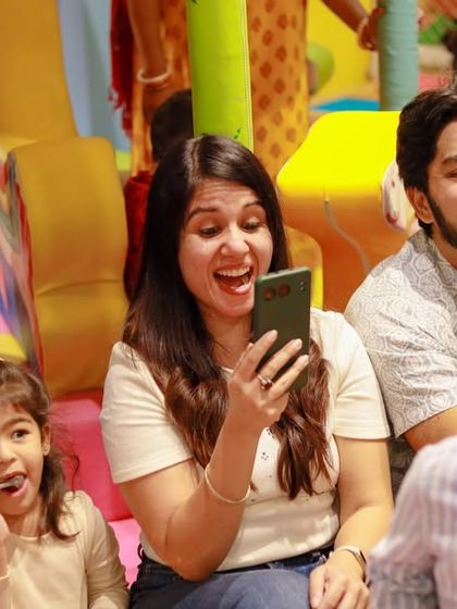 Guests capturing memories on their phones. The entire space is designed to be photo-worthy, so you can document every happy moment.