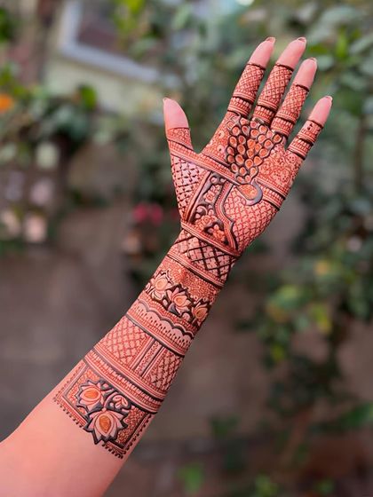 A single arm design showcasing a variety of intricate patterns and bands, demonstrating the skill and precision taught in our classes.