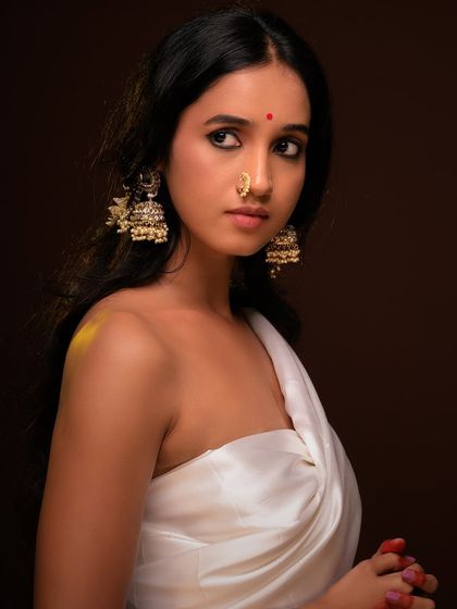 A direct gaze at the camera, creating a powerful and confident portrait.