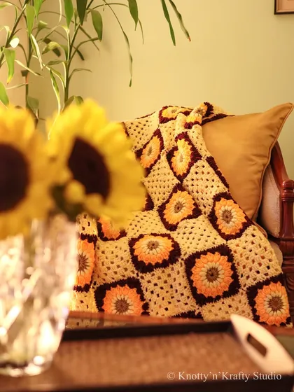 As the cooler evenings approach, a cozy throw becomes essential. This sunflower granny square throw is one of my favourites, bringing together warm colours and classic crochet patterns to create a blanket that’s perfect for draping over a chair or curling up in.