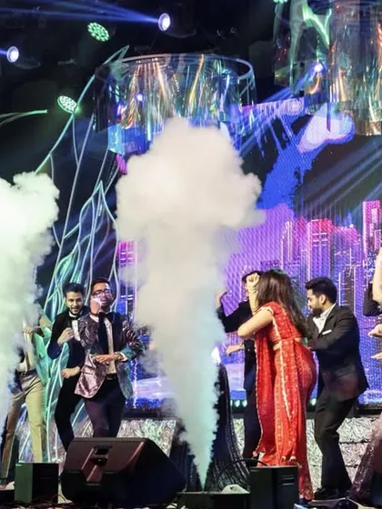 The couple and their friends take over the stage in a cloud of smoke. Our Sangeet setups are designed to be interactive and fun, with special effects that make everyone feel like a star.