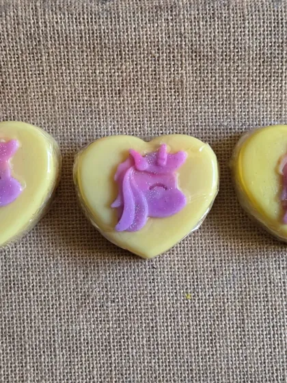A cute, heart-shaped soap with a unicorn inside. These are individually wrapped and perfect as small party favors.