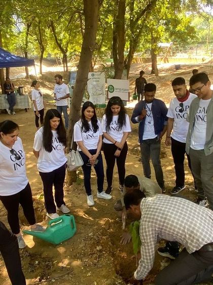 Our team demonstrates the proper planting technique to the Gap Inc. volunteers, ensuring every sapling is planted for long-term success.