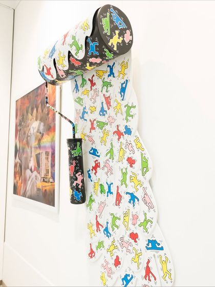 A side view of the "Dripping Pop" installation, showing how it extends from the wall to create a sense of motion.