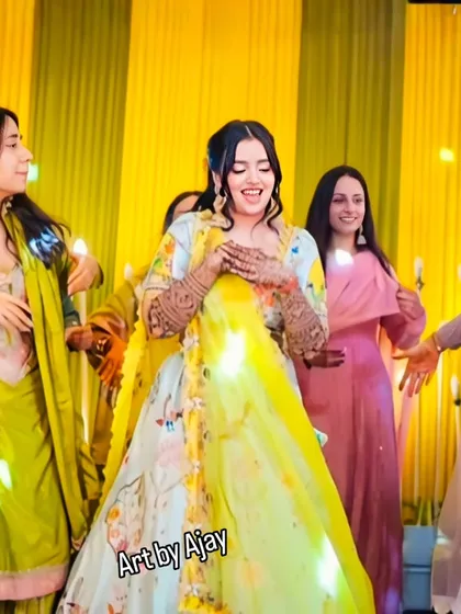 A candid shot of the bride laughing and dancing, her hands beautifully decorated with my henna art.