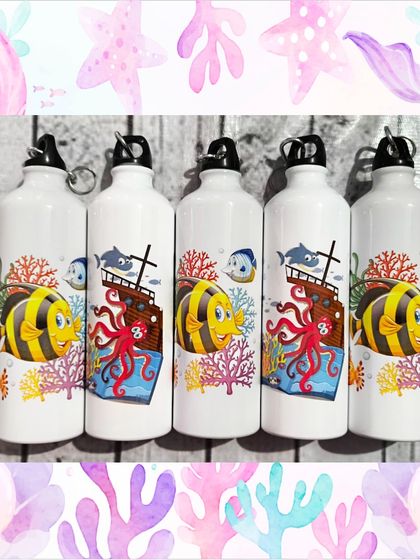 A close-up of the underwater-themed bottles for the boys, featuring a friendly octopus, a sunken ship, and colorful fish.