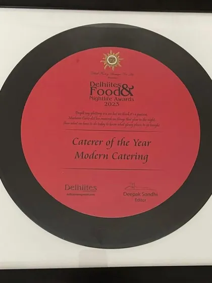 The beautifully designed 'Caterer of the Year 2023' award from Delhiites. This motivates us to keep pushing the boundaries of gourmet catering.