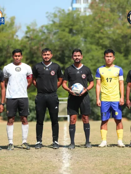 Respect on the pitch. Our captain stands with the opposition captain and match officials before the game.