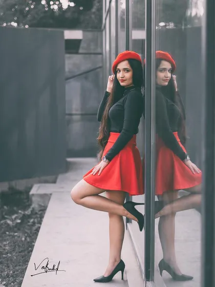 Capturing the chic 'Emily in Paris' vibe with a creative twist. I used a selective color technique to make the red skirt and beret pop against a monochrome background, highlighting the model's reflection for a stylish, modern portrait.