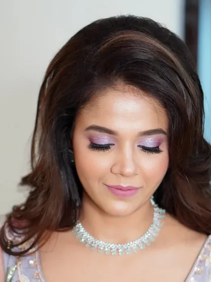 A closer look at the delicate, shimmering lilac eyeshadow. This detail shot shows the artistry involved in creating a look that is both unique and timelessly beautiful.