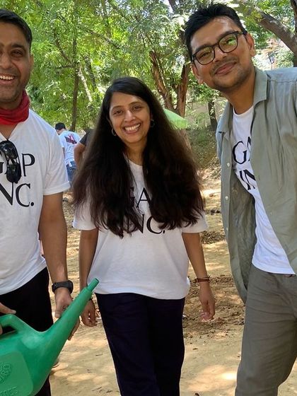 Three volunteers from Gap Inc. share a happy moment after their successful plantation drive at Aravali Creek.